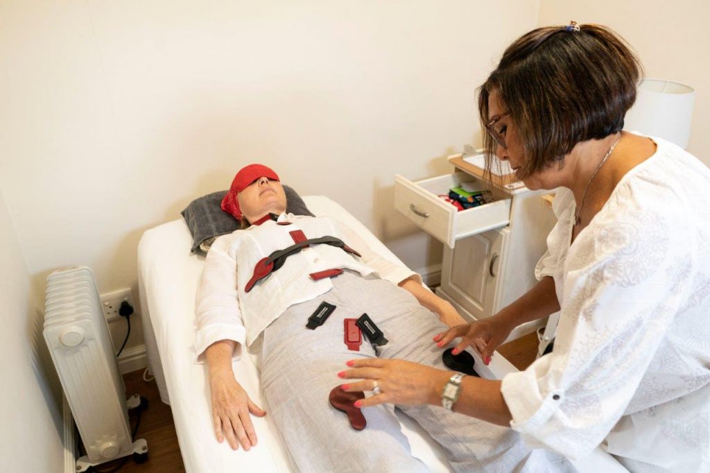 A medical biomagnetism session being performed